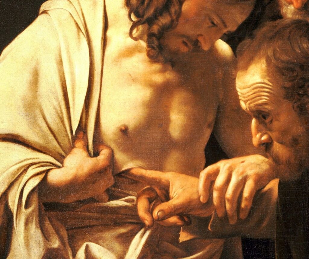 Fragment obrazu Caravaggia "Niewierny Tomasz", na którym św. Tomasz wkłada palec w bok Jezusa.